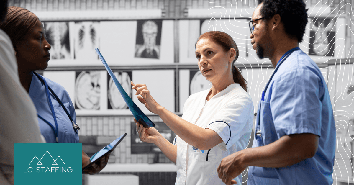 A group of healthcare professionals in conversation, illustrating the workforce shortages Montana is facing.
