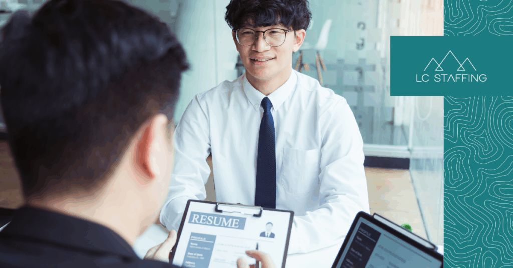 Job candidate presenting resume tips during a hiring meeting with a recruiter