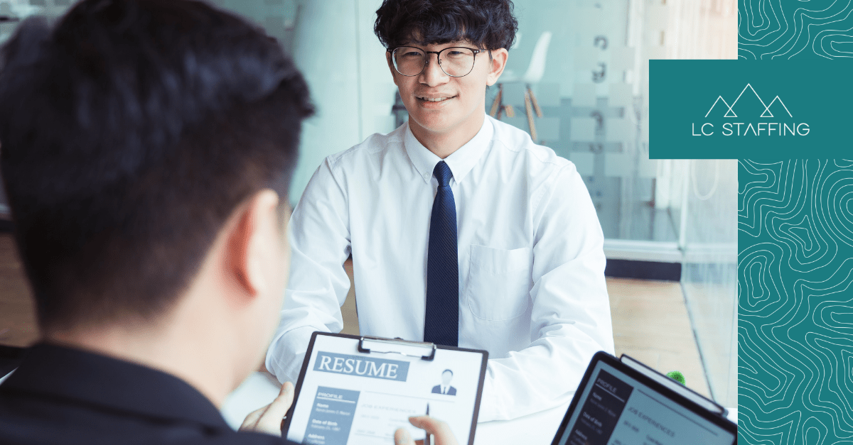 Job candidate presenting resume tips during a hiring meeting with a recruiter