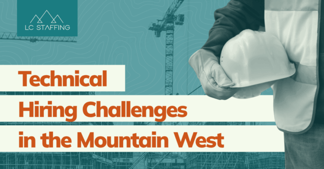 Construction worker holding a hard hat representing the challenges of hiring engineers in the Mountain West