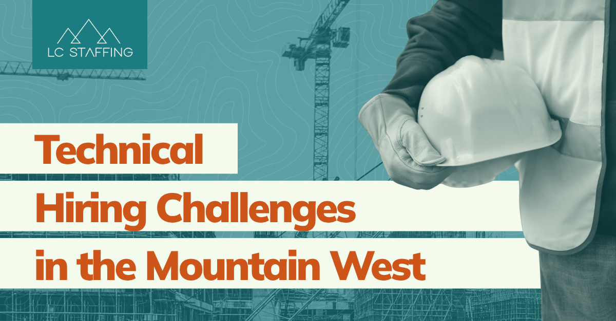 Construction worker holding a hard hat representing the challenges of hiring engineers in the Mountain West