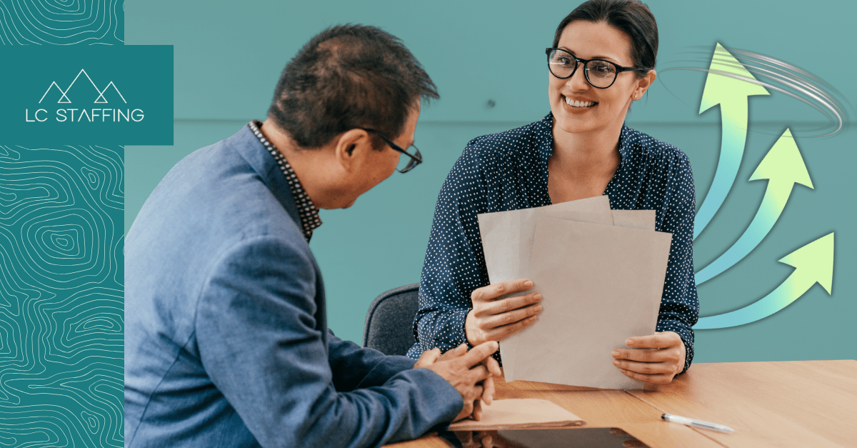 An employer and candidate meet face to face, illustrating how hiring speed shapes the outcome of competitive recruiting.