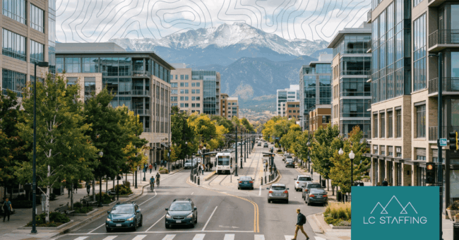 Labor market trends in the Mountain West shown through a busy Mountain West city street scene