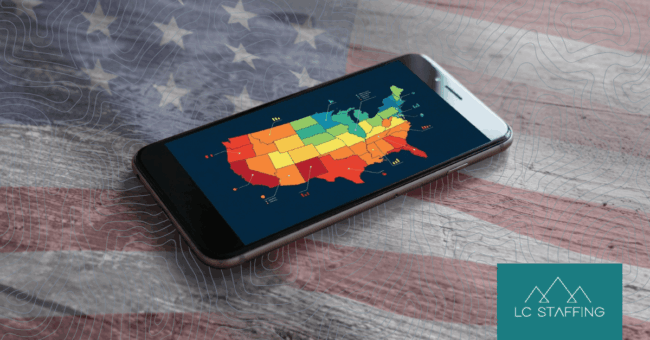 A phone displaying a color-coded U.S. labor map, illustrating how hiring in a new state varies by region, with the LC Staffing logo.